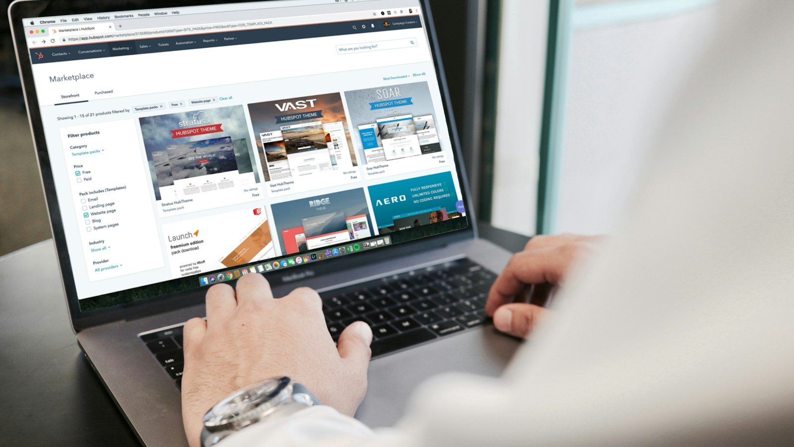 Person working on a laptop while planning an online store checkout